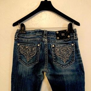 Miss Me Jeans with embroidered pockets.